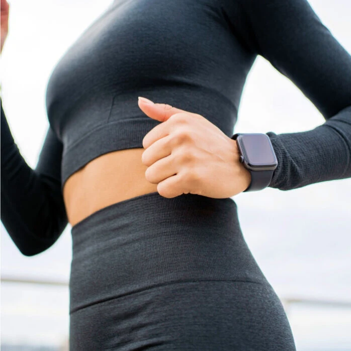 FitiWatch wrist-worn smartwatch on active runner during outdoor exercise
